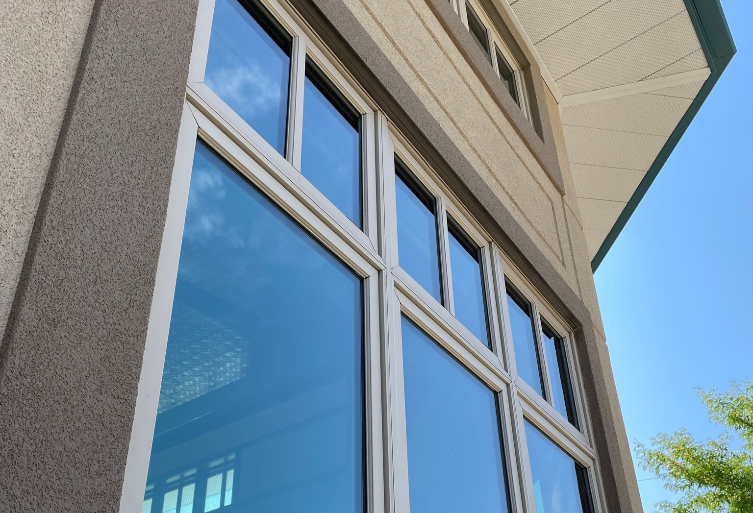 Clean residential windows beneath a wide Wyoming sky